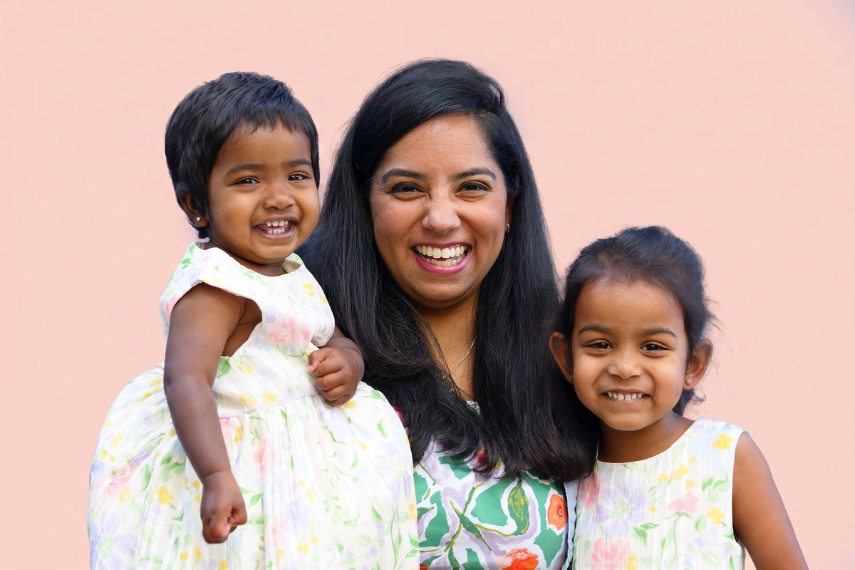 Amrita Kudos founder with her daughters smiling - WeNatal Milk + Mood