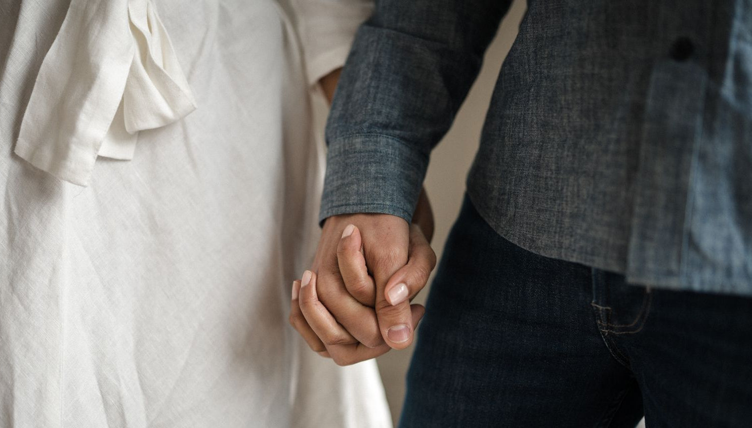 close up of couple holding hands - WeNatal prenatal - WeNatal mens fertility support