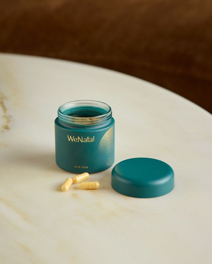 opened glass jar of male fertility supplement on table - WeNatal for Him