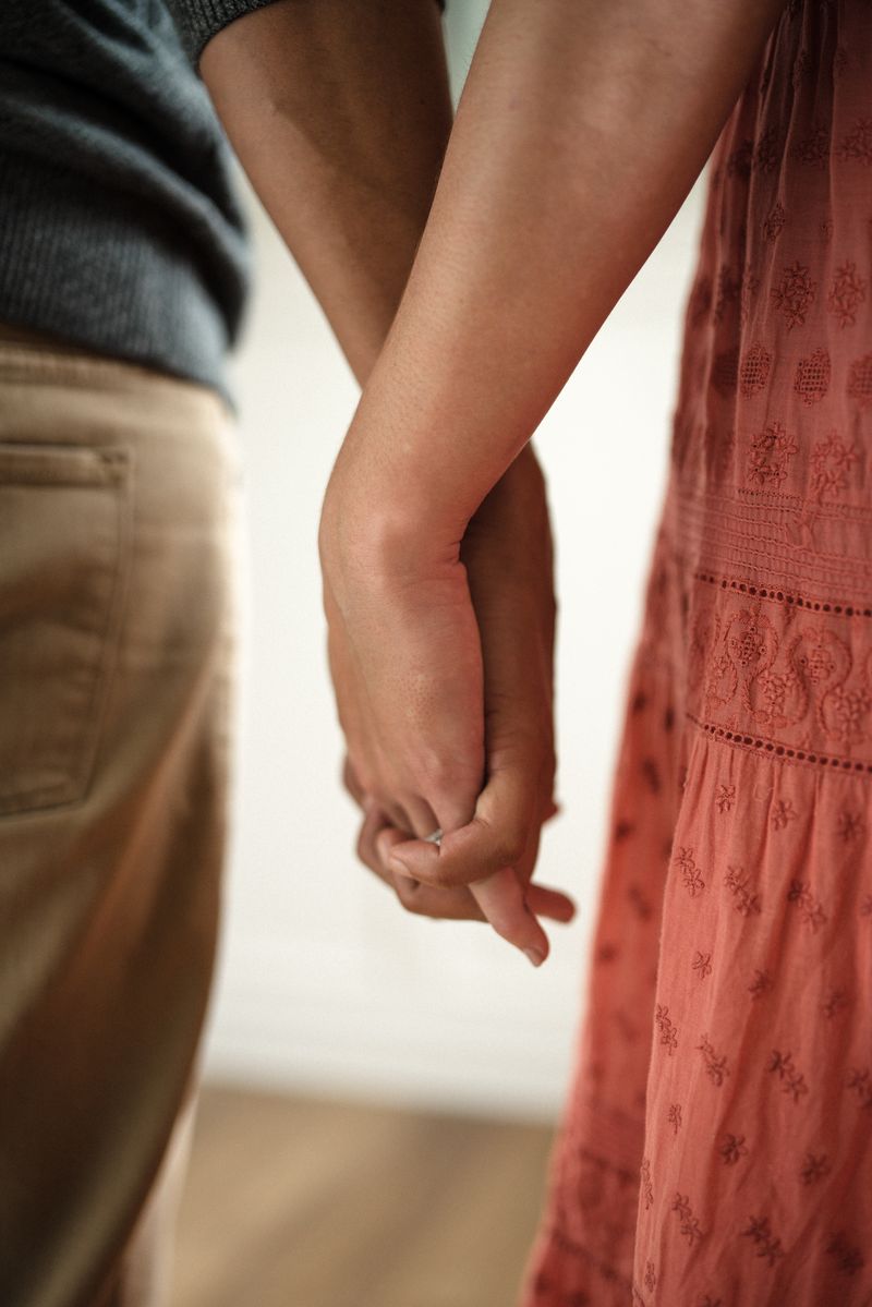  close up of couple holding hands - WeNatal partner support during pregnancy
