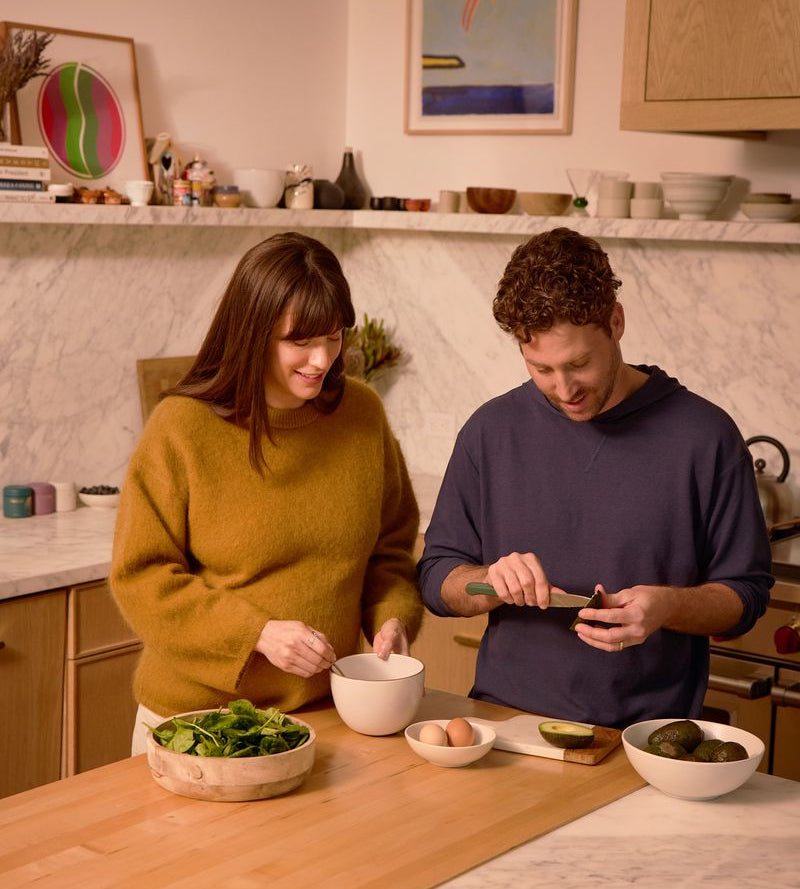 Couple preparing a balanced, protein-forward meal in a bright kitchen, WeNatal PCOS nutrition support