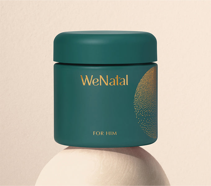 WeNatal For Him Welcome Kit in a teal-green jar, offering 90 capsules for prenatal and fertility support, captured on a smooth sphere in a minimalist setting.