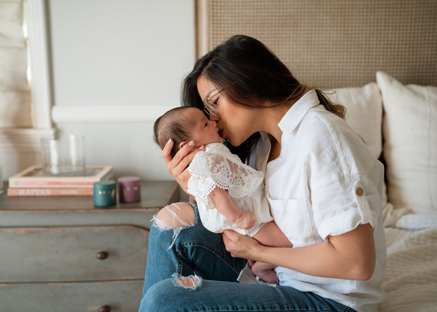 mom kissing newborn baby Wenatal