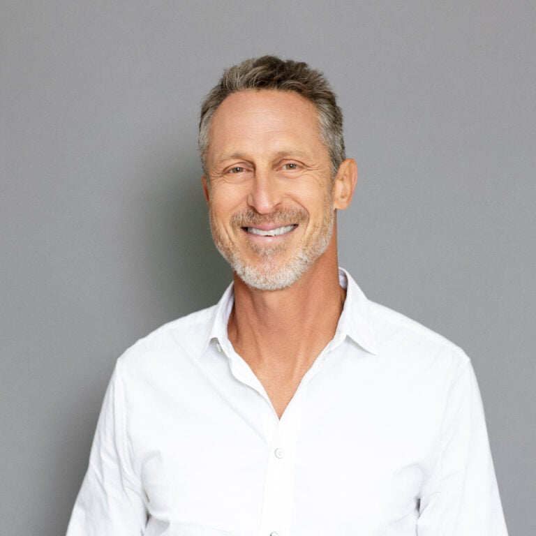 half body photo of Mark Hyman smiling