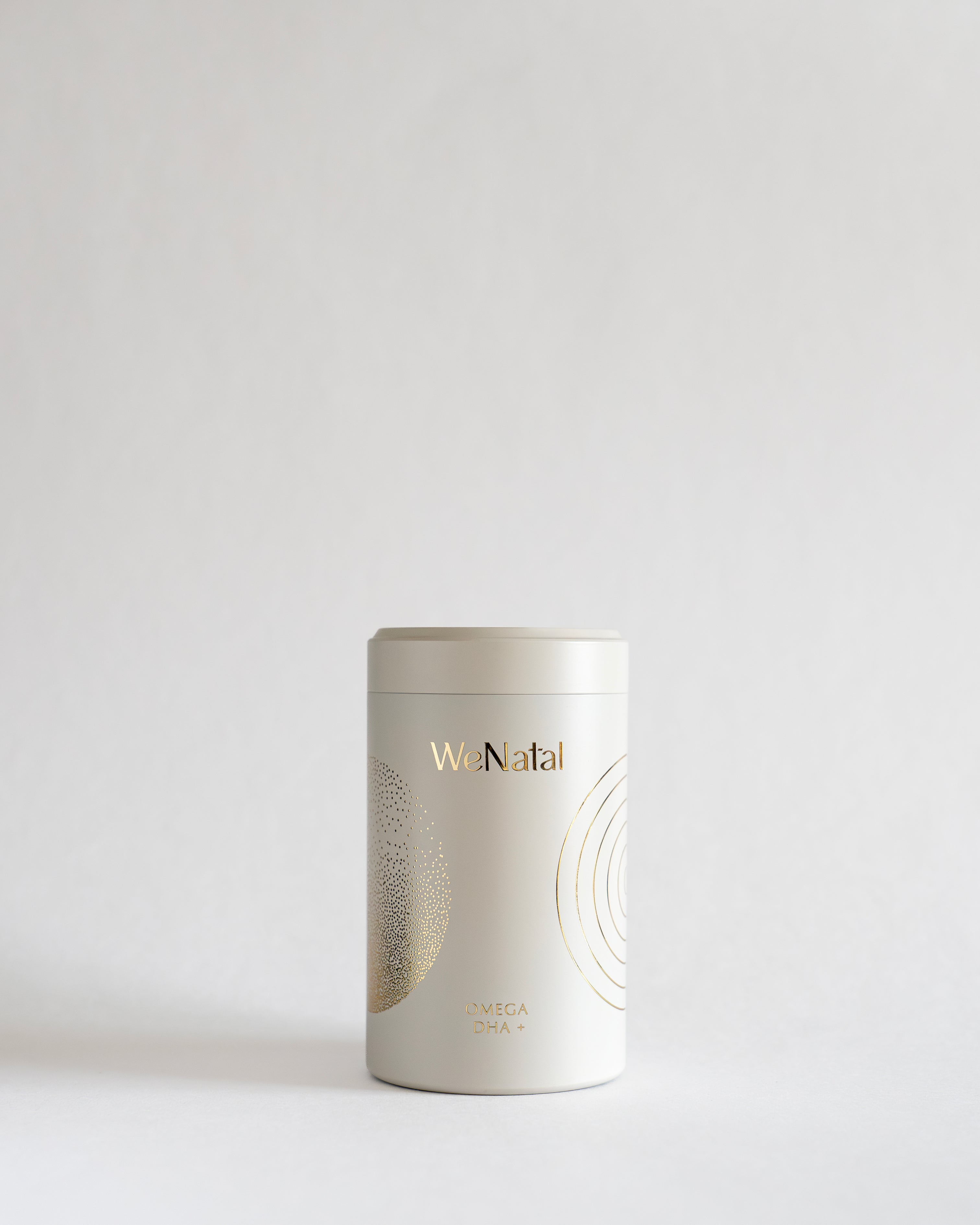 WeNatal Omega Jar - Bonus: A white cylindrical container labeled Omega DHA+ with gold-foil graphics, designed for prenatal vitamin supplements