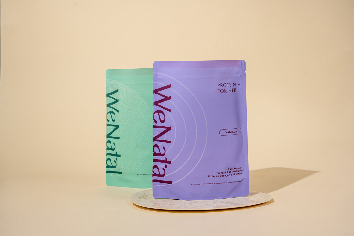 WeNatal Protein+ Together packets for prenatal/postnatal support, featuring Protein + Collagen + Vitamins, displayed on a stone platform.