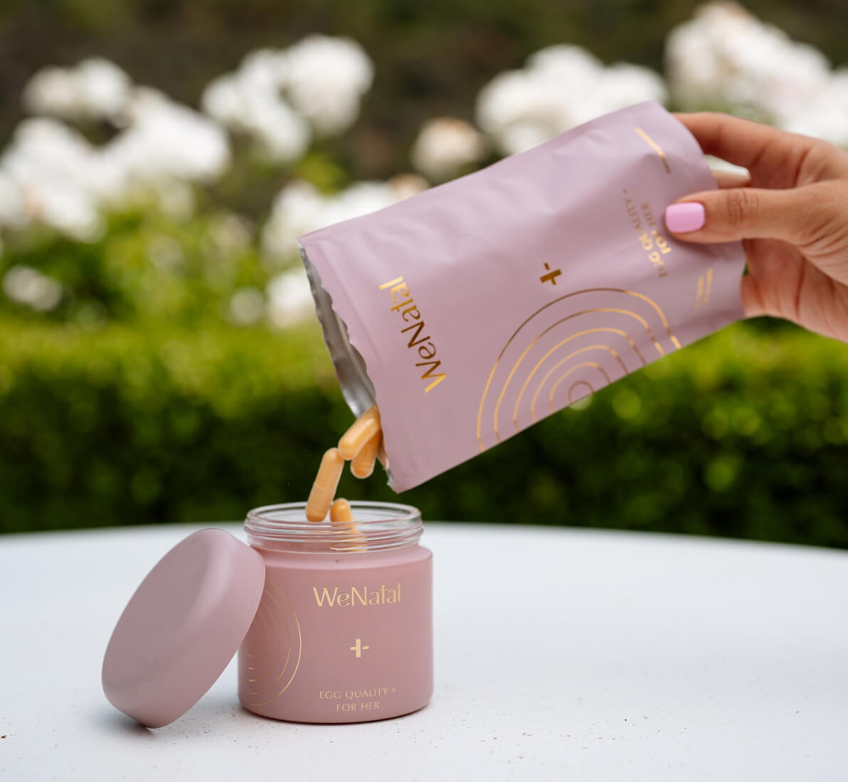 WeNatal Egg Quality + refill getting poured into the welcome kit jar