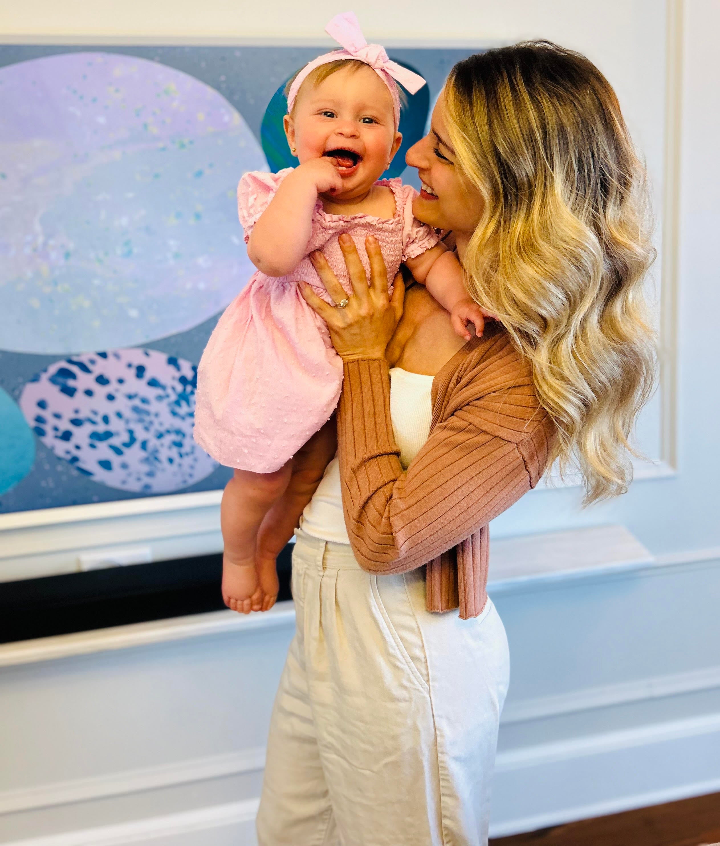 Cassi and her baby smiling 