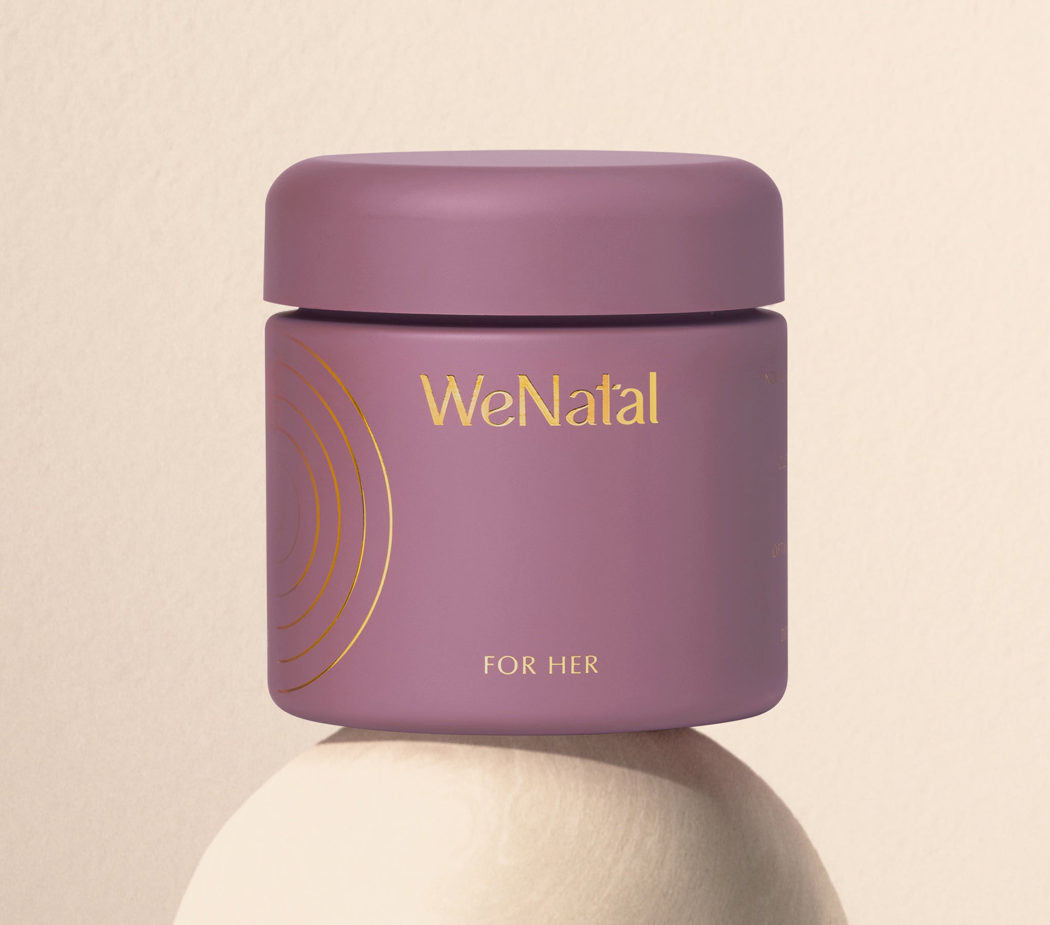 WeNatal For Her Welcome Kit, a cylindrical jar with gold embossing, offers 90 capsules for daily prenatal and fertility support, emphasizing essential nutrient and omega-3 DHA support