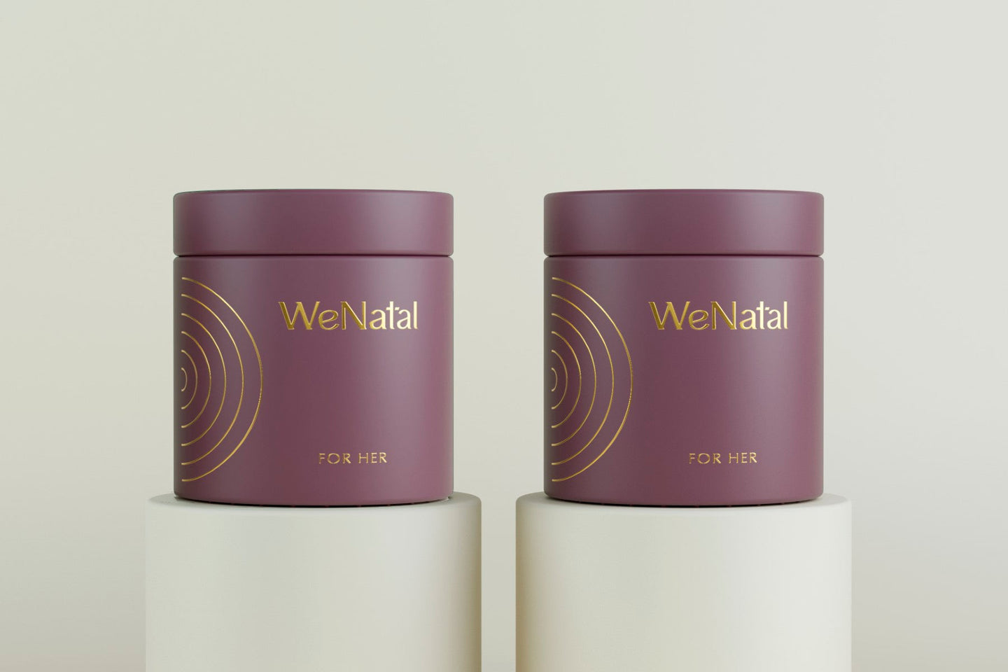 Two WeNatal For Her glass jars side by side on pedistals on a white background