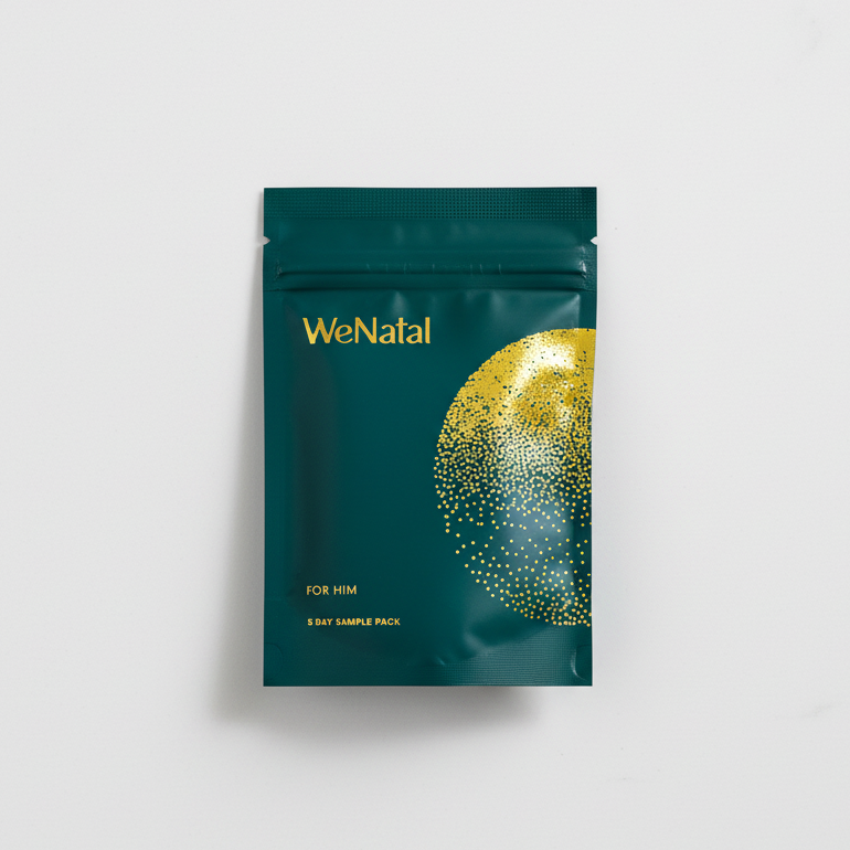 WeNatal For Him - Five Day Sample Pack in a resealable pouch, featuring a stylized golden-dot circle, designed for male prenatal vitamin supplementation.